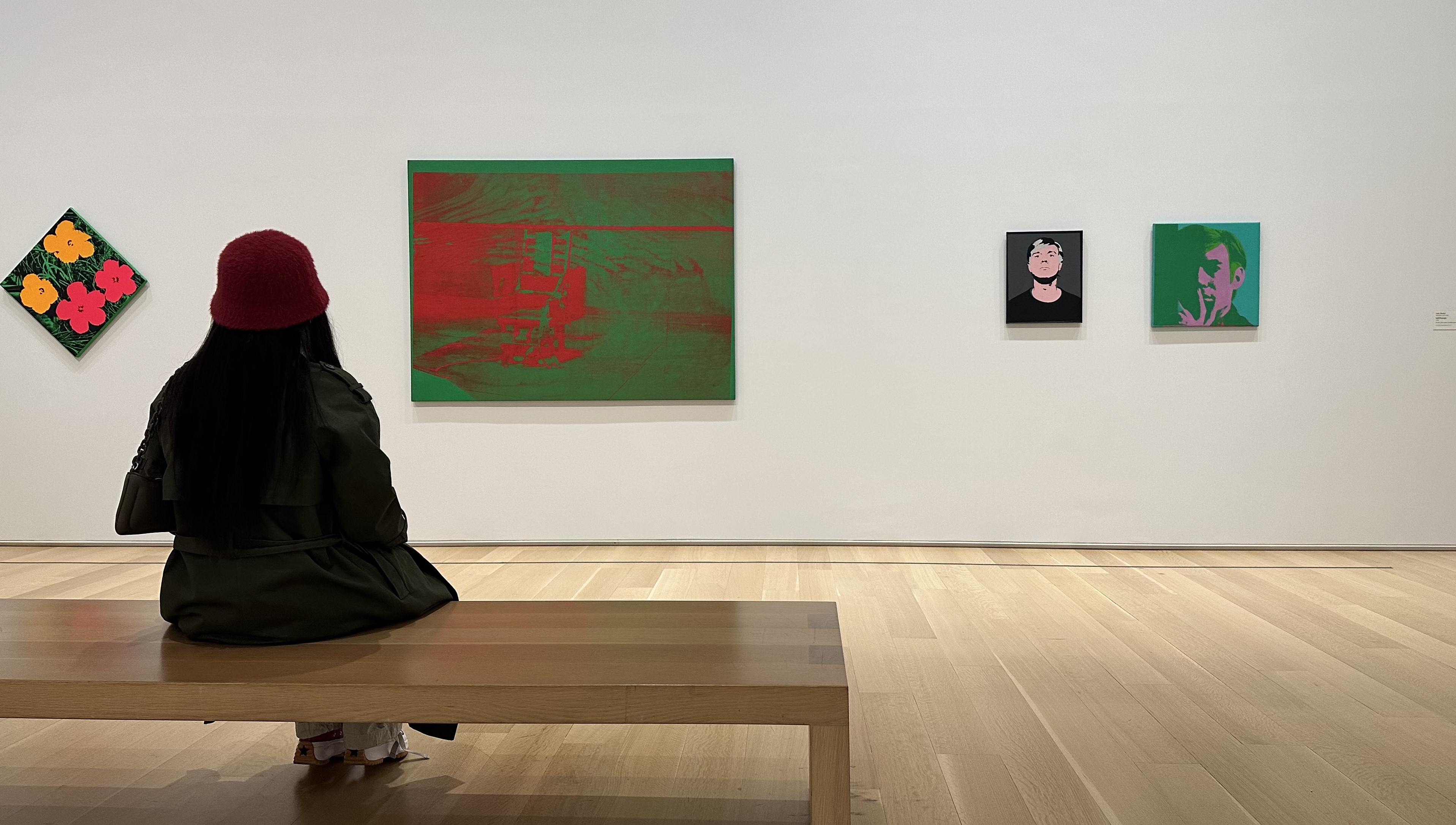 ha girl sitting and facing an artwork